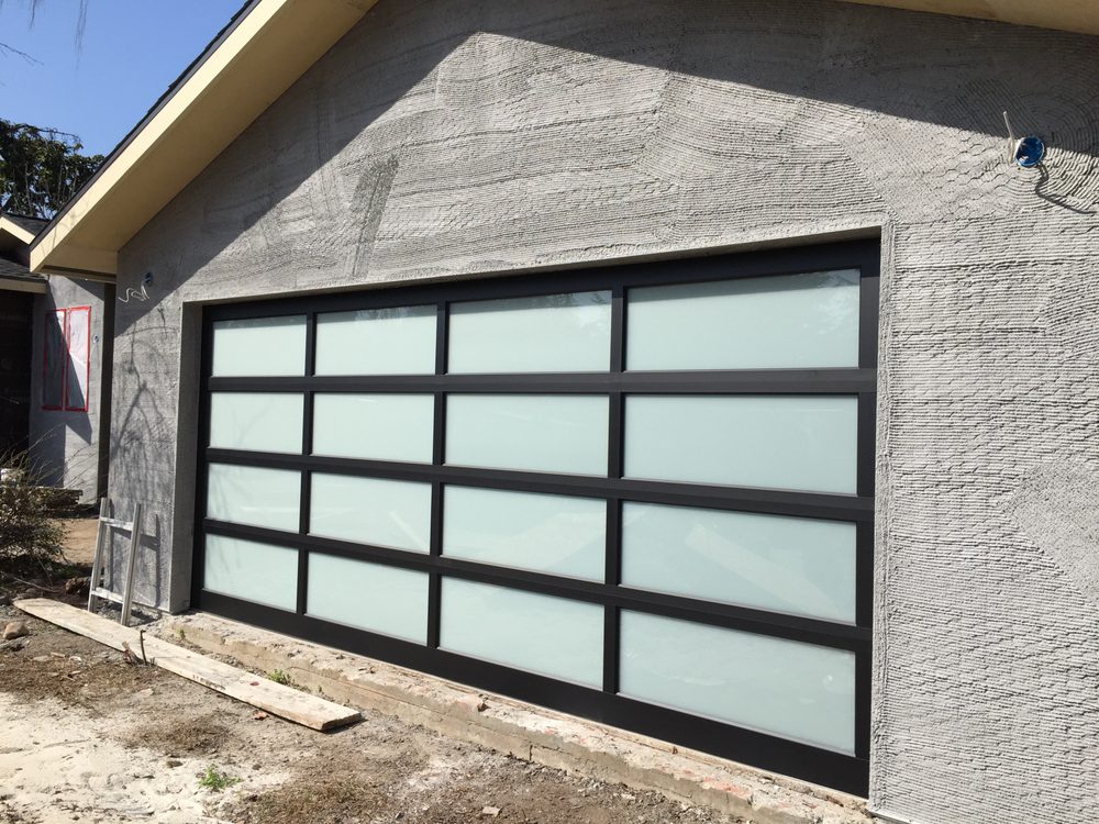 Modern frosted glass garage door on new construction